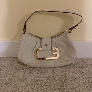 Beige Guess clutch purse